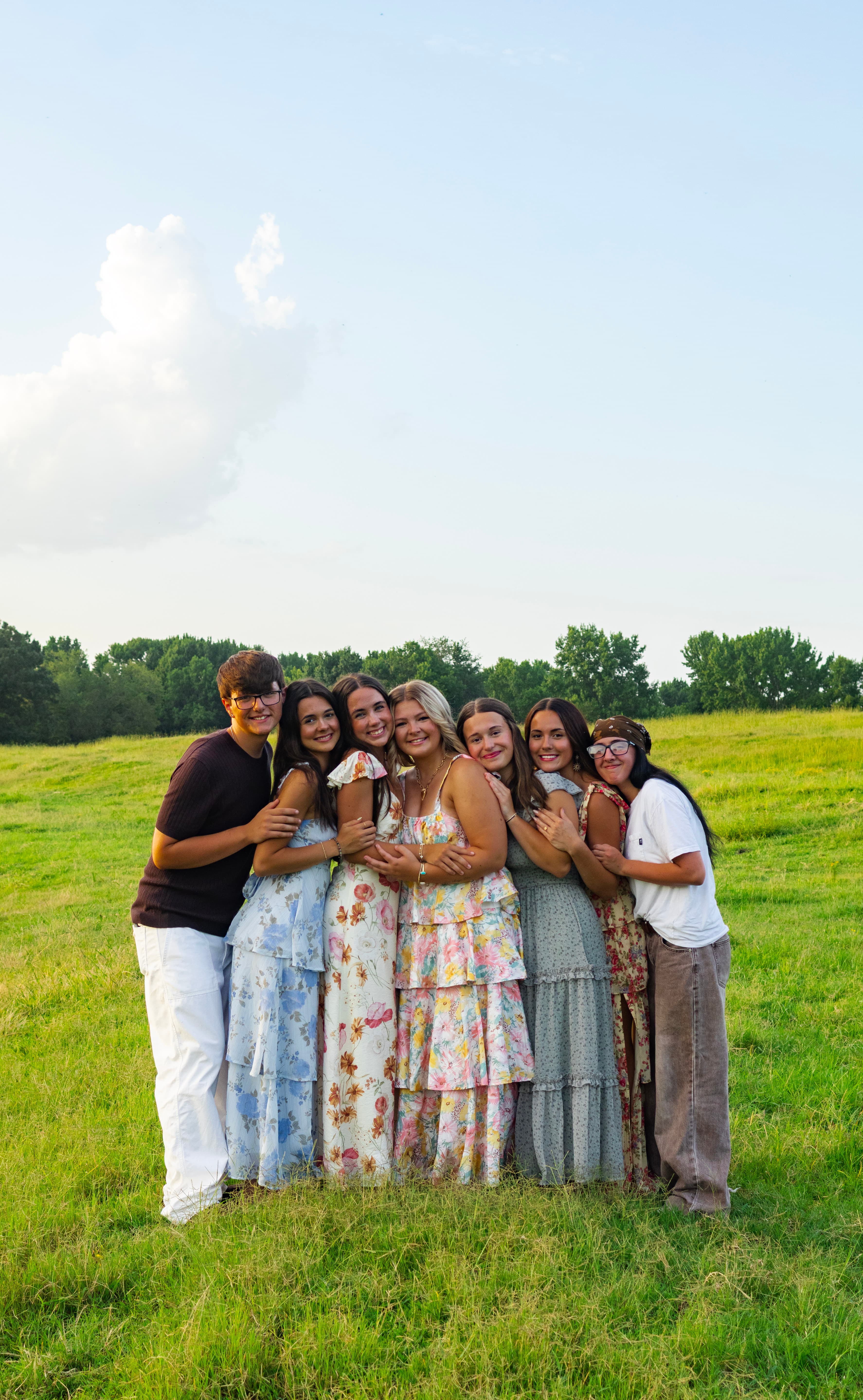 Group portrait outdoors with soft light and candid connection