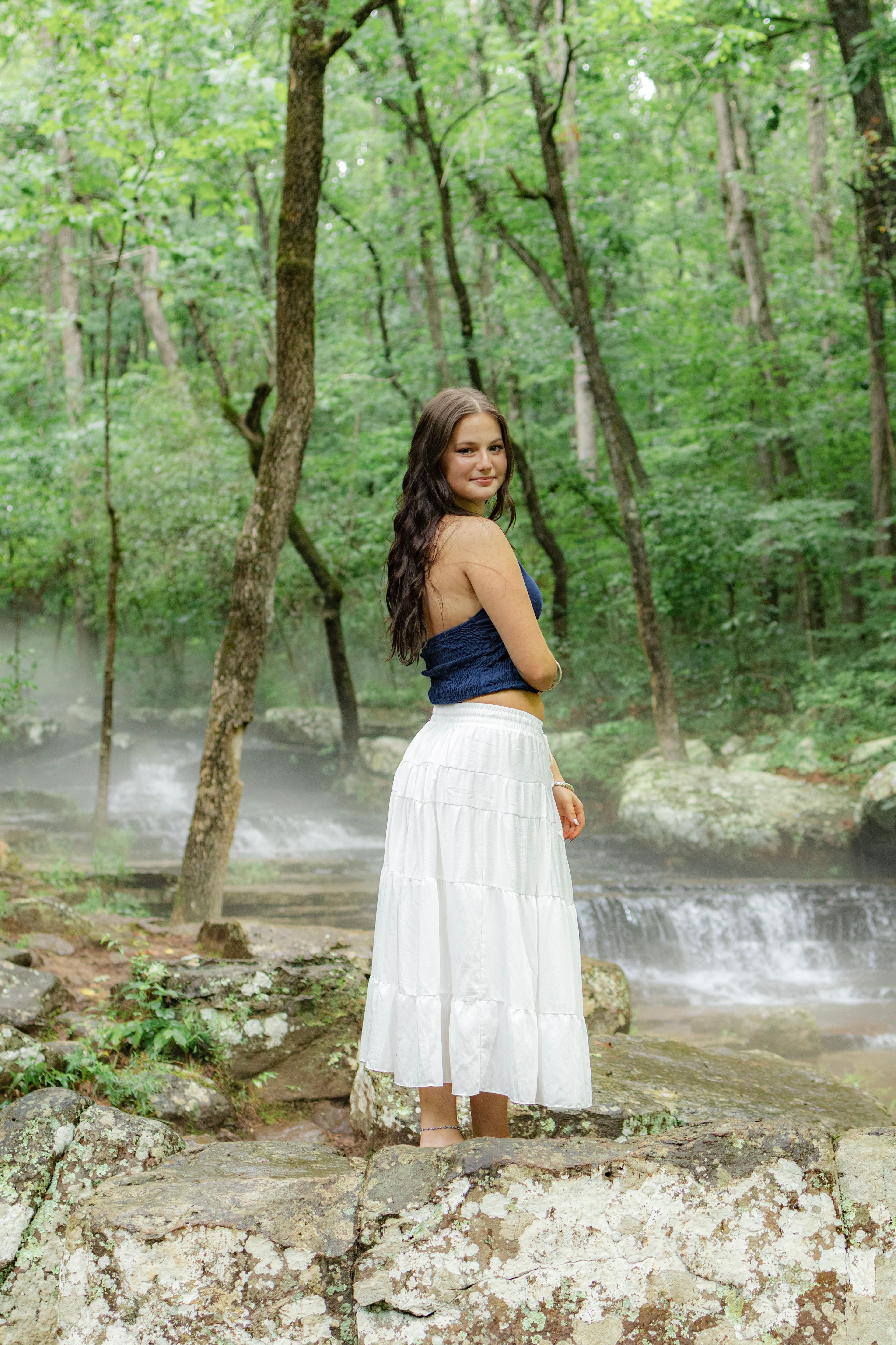 Outdoor senior portrait with natural light and greenery