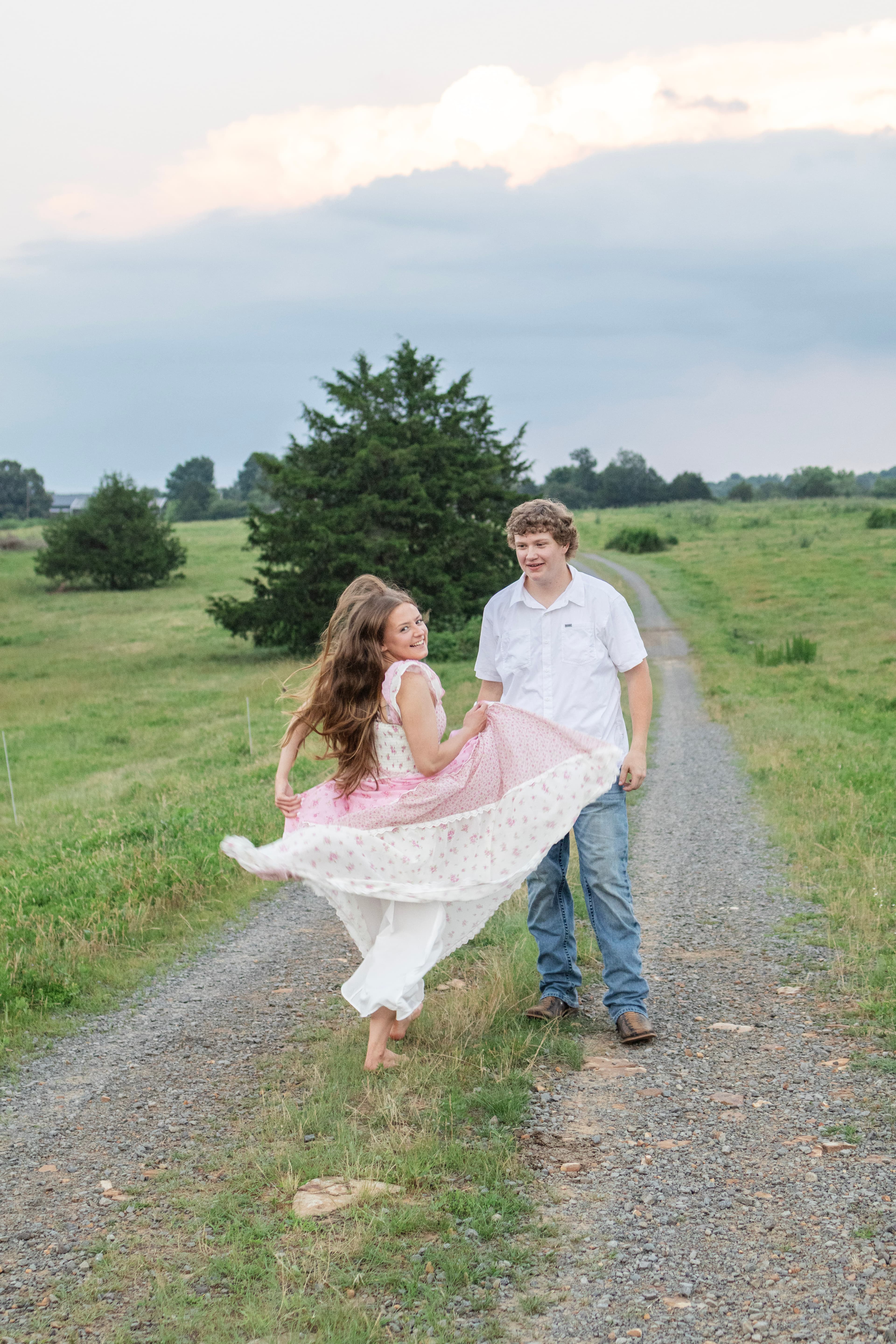 Couple walking together on a country road during an outdoor session